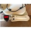 Image 5 : Straight stairlift system, with its motorized chair unit, padded seat, and an extruded aluminum modu