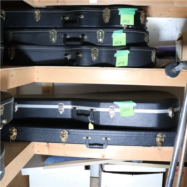 Two black hard-shell guitar cases
