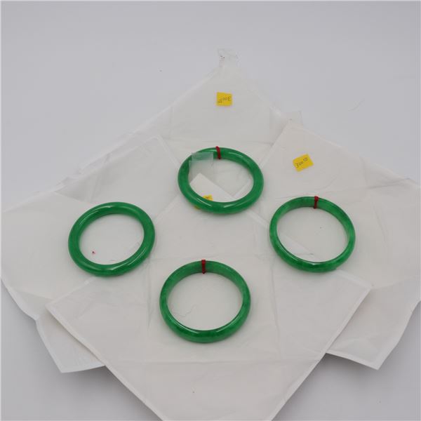 Set of Four Green Stone (Likely Jade or Hardstone) Bangle Bracelets