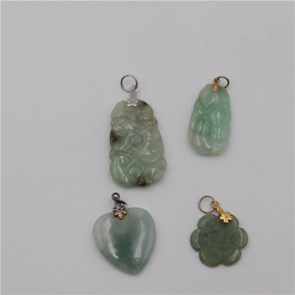 Lot of Four Carved Green Stone Pendants