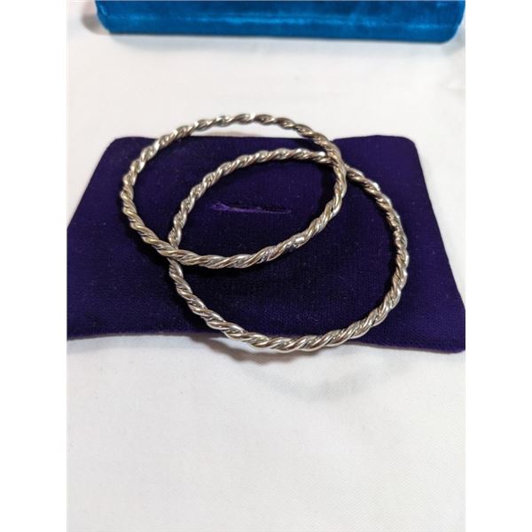 PAIR OF TWISTED DESIGN SILVER BANGLES