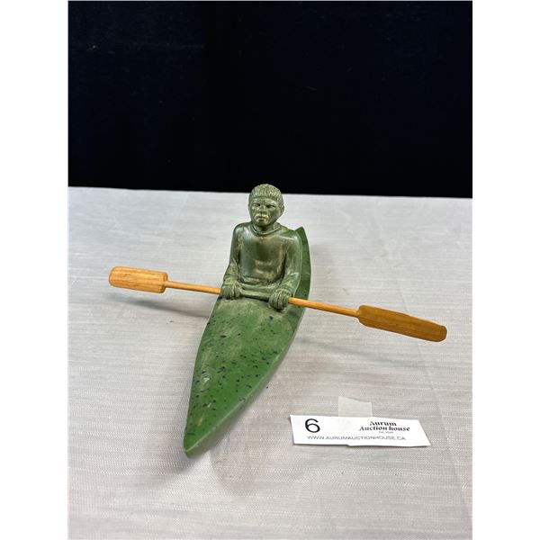 A Very Nice Inuit Carving of Man in Kayak with Wooden Paddle