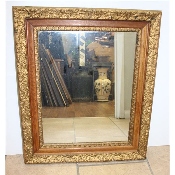 ORNATE FRAMED MIRROR. MEASUREMENTS:27"X23"