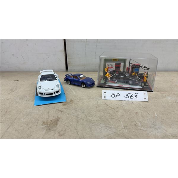 Schuco Diorama Junior Line with 1/43 Porsche 911, 1/43 Porsche 911, and 1/32 Porsche 911-GTS