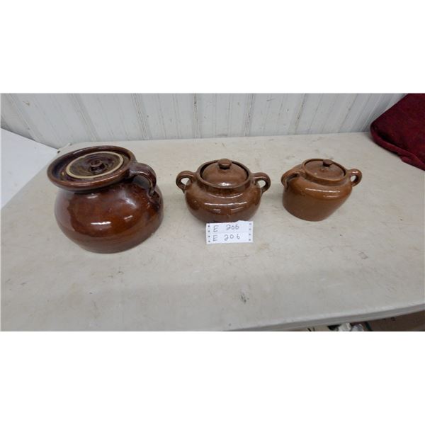 Set of Three Brown Glazed Earthenware Lidded Vessels, One Single-Handle Jar and Two Twin-Handle Pot