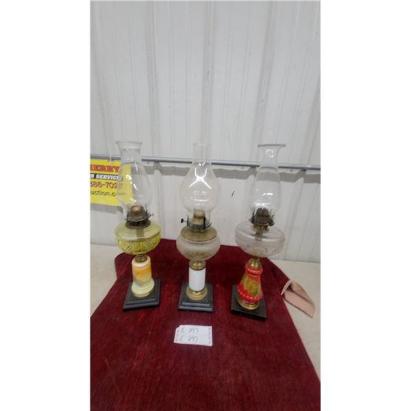 Three Antique Oil Lamps: Yellow-Green Patterned, Frosted Glass, and Clear With Painted Pedestals
