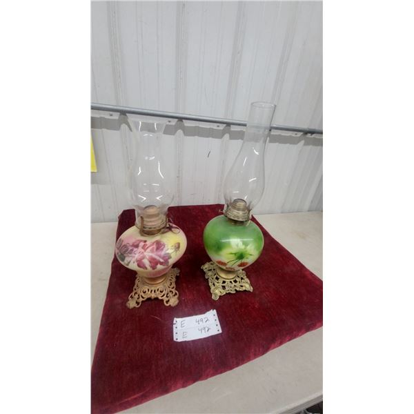 Pair of Antique Hand-Painted Floral Glass Oil Lamps with Ornate Cast Metal Bases