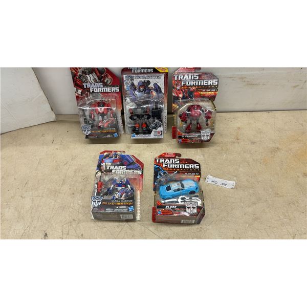 Five Transformers Action Figures: Cliffjumper, Trailcutter, Blurr, and Sideswipe