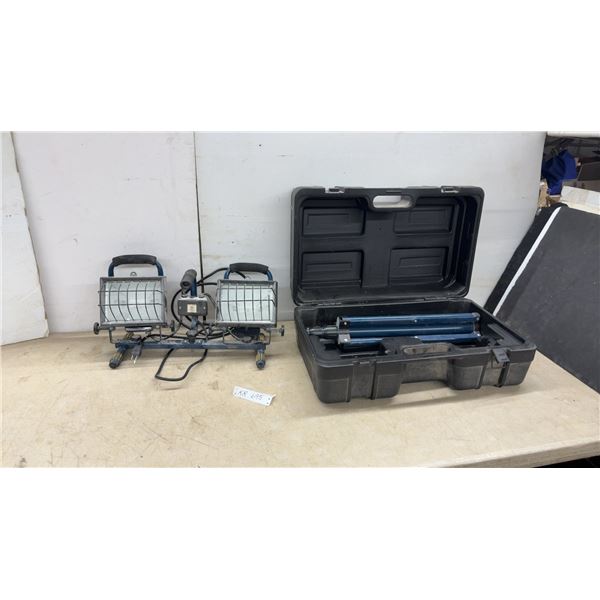 Koma Dual Halogen Work Light and Tripod in Hard Case. One latch broken