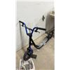 Image 2 : Mongoose Black and Blue Scooter with Skull Deck, Front and Rear Brakes, and Blue Spokes