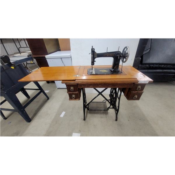 Antique Raymond Treadle Sewing Machine in Ornate Wooden Cabinet With Four Drawers