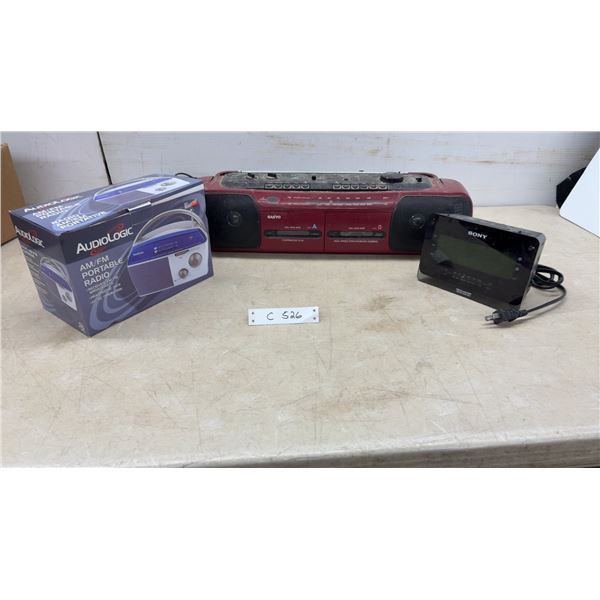 AudioLogic AM/FM Portable Radio, Sanyo Dual Cassette Stereo, and Sony Dream Machine Clock Radio