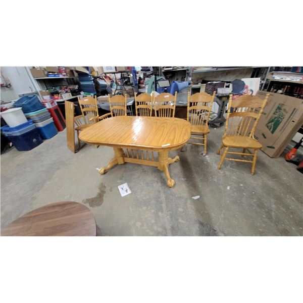 Oak Oval Pedestal Dining Table with Ball and Claw Feet and 6 Spindle-Back Chairs
