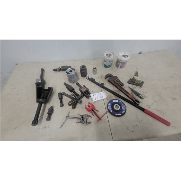 Assorted Tools: Pipe Wrench, Gear Puller, and Sockets
