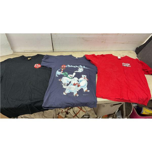 Lot of 3 Coca-Cola T-Shirts Including Black, Red, and 1993 Blue Polar Bear Ice Sports Graphic