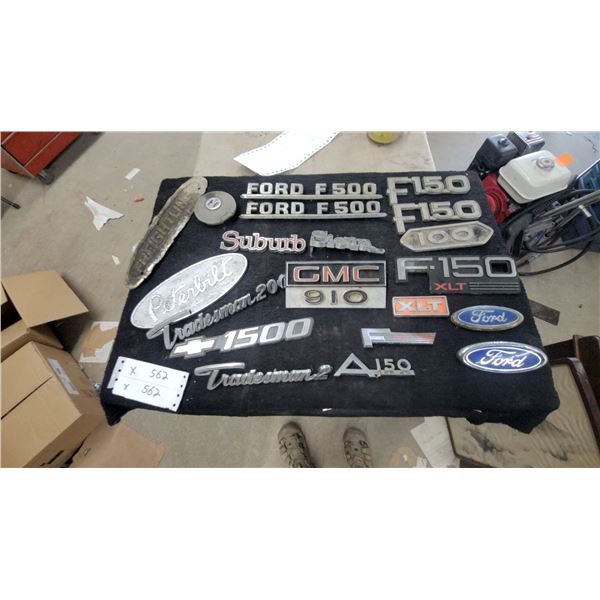 Assortment of 19 Truck Emblems: Ford F-150, F-500, F-100, Peterbilt, GMC, Tradesman