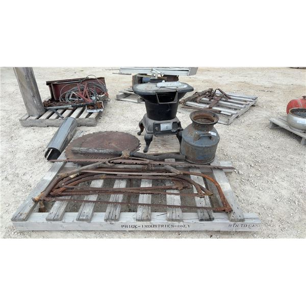 Pallet Lot: Antique Cast Iron Parlor Stove, Milk Can, and Saws