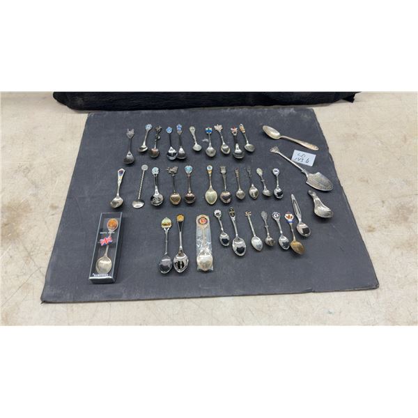 Collection of Assorted Decorative Souvenir Spoons Featuring Landmarks and Regional Emblems