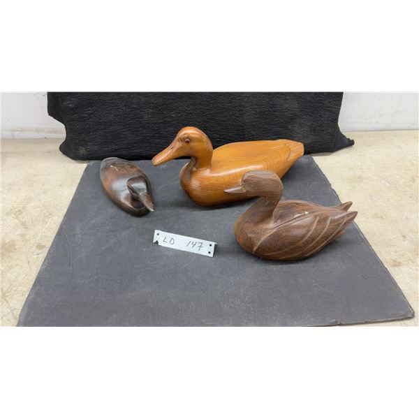 Three. Hand-Carved Wooden Ducks, Largest 6 1/4 × 13 × 5 1/4”