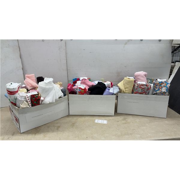 Three Boxes of Assorted Fabric Rolls in Various Colors, Prints, and Sizes