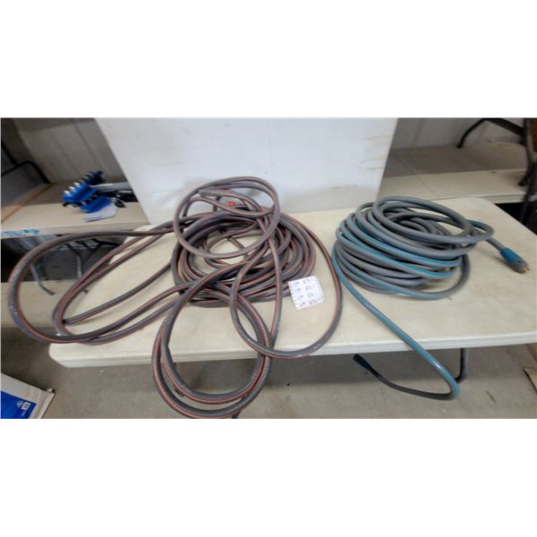 Two Garden Hoses, One Gray with Blue Stripe and One Gray with Orange Stripe