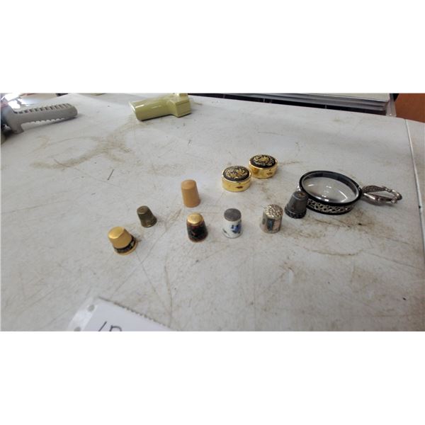 Collection of Thimbles and Magnifying Glass