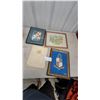 Image 1 : Four Framed Artworks and An Open hbc. Book with Illustrations