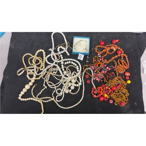 Lot of Fashion Jewelry Including Beaded Necklaces in Cream, Red, Orange, and Clear