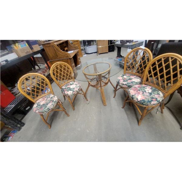 Rattan and Glass Dining Table with 6 Rattan Chairs with Floral Cushions