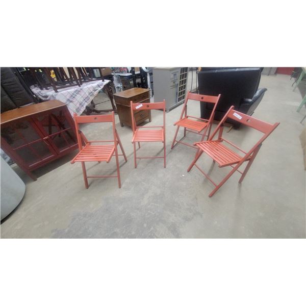 Four Orange Folding Chairs