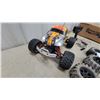 Image 3 : HPI Racing E-Savage RC Truck, Remote Control, Charger, and 4 Extra Tires