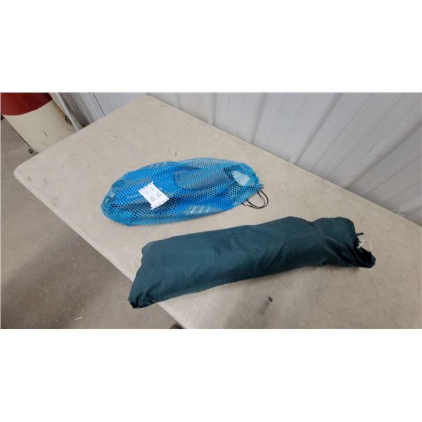 Green Tent or shelter and Blue Mesh Bag with snorkel gear