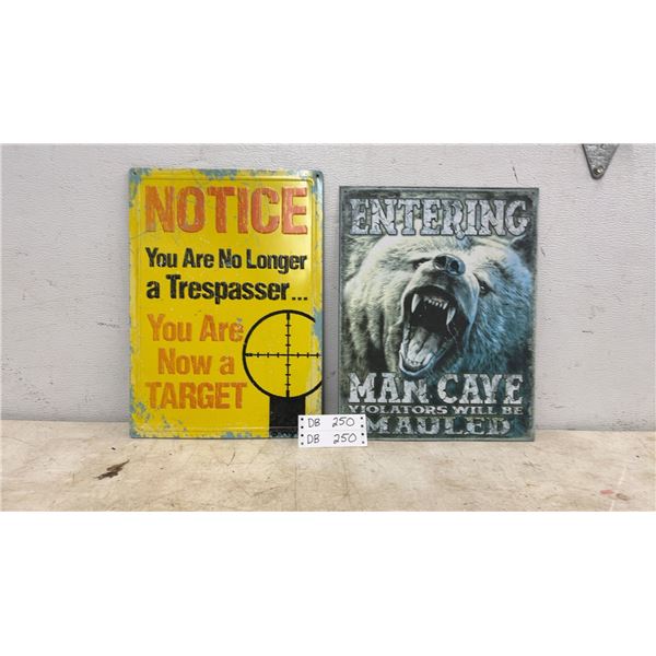 Two Metal Signs: Trespasser Notice and “Entering Man Cave”