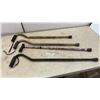 Image 1 : Four Adjustable Aluminum Walking Canes: Leopard Print, Bronze, Purple Floral, and Black