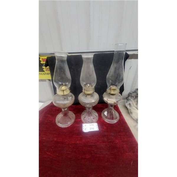Three Clear Glass Kerosene Lamps with Brass Burners and Chimneys