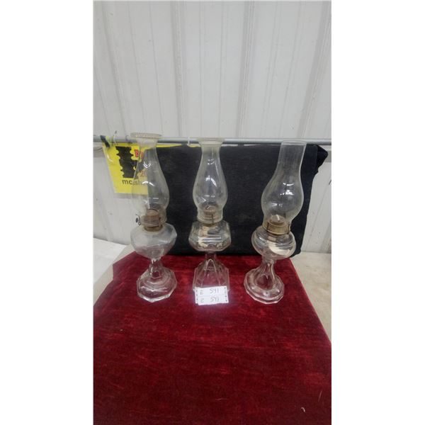 Three Clear Glass Oil Lamps, Each with Chimney and Burner, Hexagonal and Round Bases