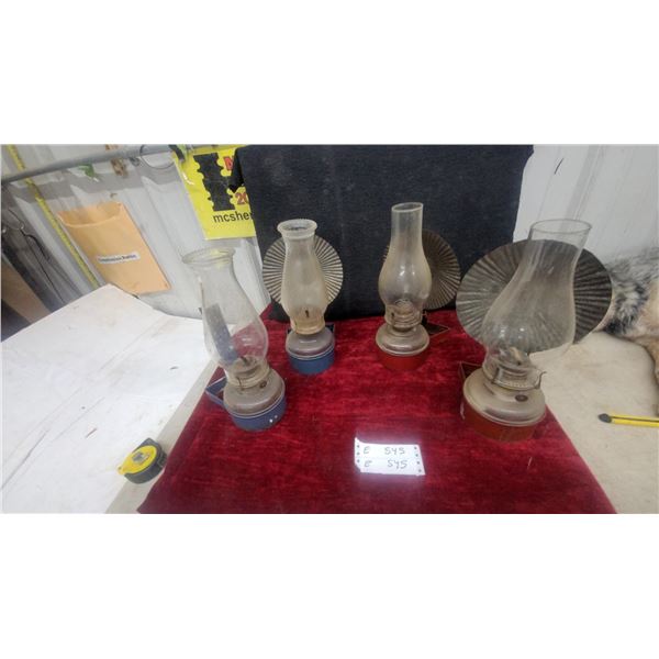 Four Kerosene Lanterns with Glass Chimneys and wall mount Metal Bases; and reflectors