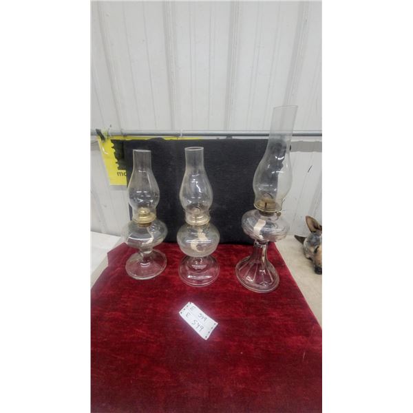 Three Clear Glass Oil Lamps with Brass Burners and Chimneys