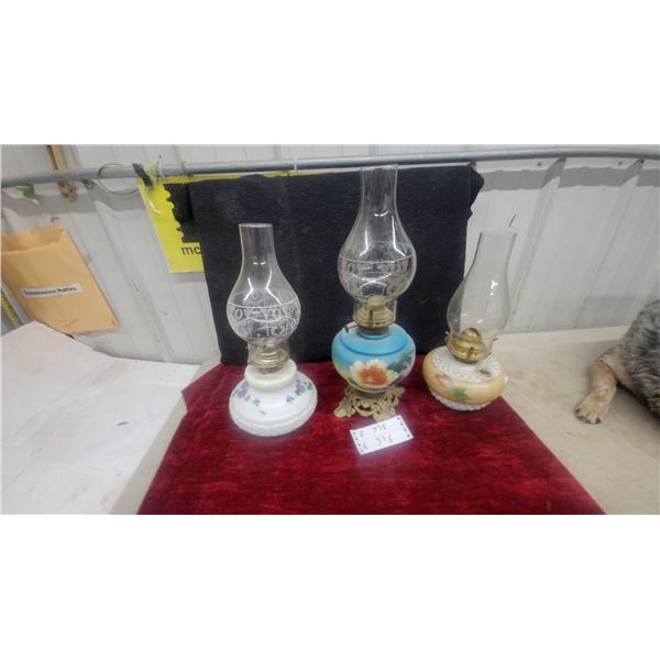 Three Oil Lamps: White Milk Glass, Blue Floral, and Yellow Floral Bases, Clear Glass Chimneys