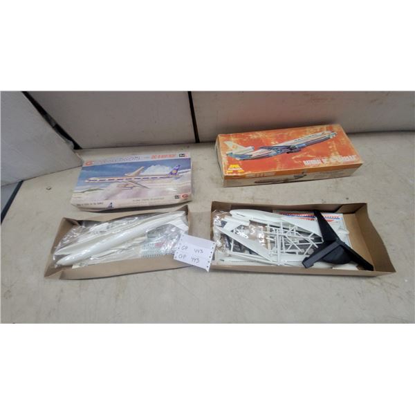 Two Revell Flying Tigers DC-8-61F/63F Model Kits and Aurora National DC-10 Model Kit