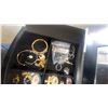 Image 5 : Black Wood Jewelry Armoire 40”×16”×10” with Mirror and Assorted Rings, Bracelets, and Earrings
