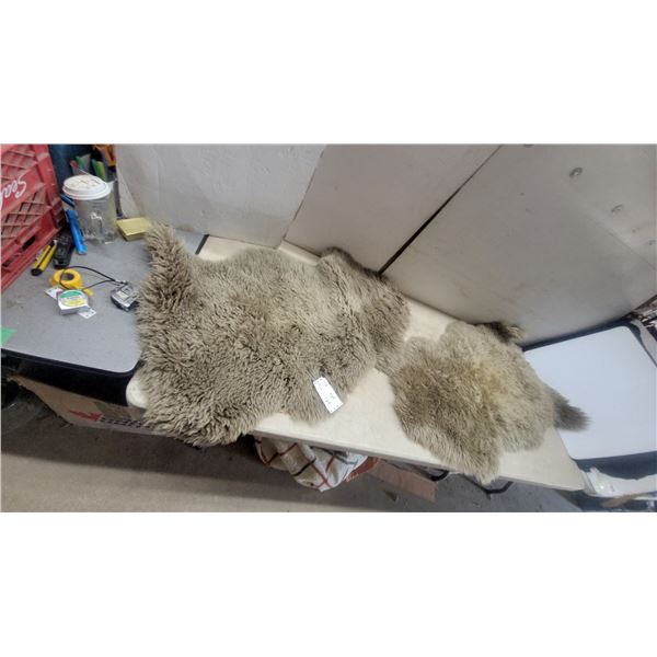 Two Sheepskin Rugs 42”×24” approx..