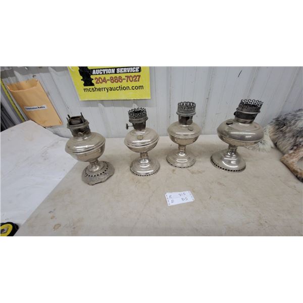 Four Silver-Plated Kerosene Lamps, no chimneys