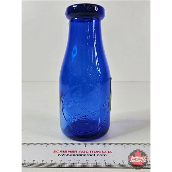 Milk Bottle : "A Bottle of Milk is a Bottle of Health" (Embossed) (Cobalt Blue) (NOTE : Flaw in Glas