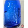 Image 4 : Milk Bottle : "A Bottle of Milk is a Bottle of Health" (Embossed) (Cobalt Blue) (NOTE : Flaw in Glas