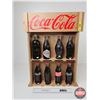 Image 1 : Coca-Cola Full Scale Replica Coke Bottles (8) : Key Dates (1899-1991) c/w Haning or Counter Top Shel