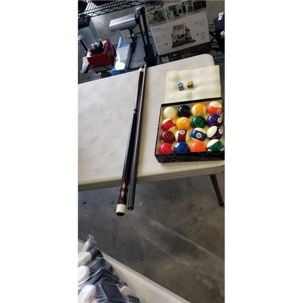 POOL CUE IN SOFT CASE AND POOL BALLS. IN GOOD CONDITION