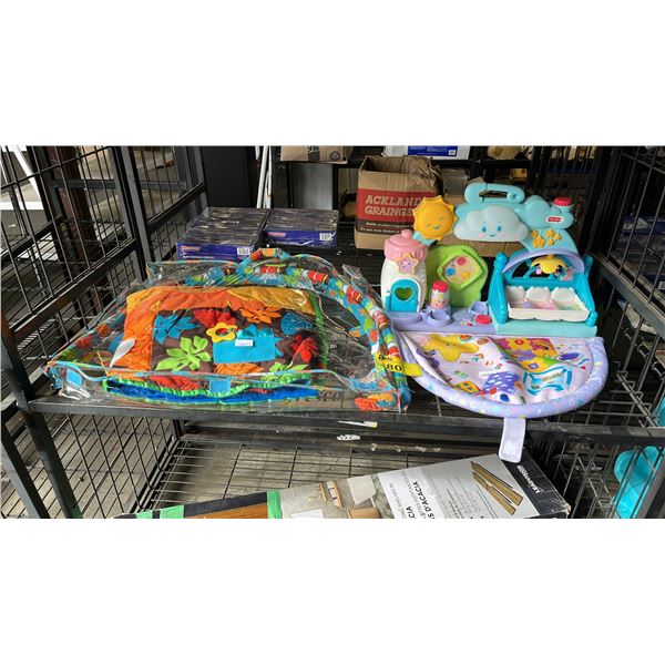 SHELF OF BABY TOYS AND PLAY MAT
