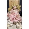 Image 1 : Porcelain Doll with Blonde Curly Hair and Pink Dress