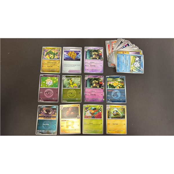 STACK OF ASSORTED POKEMON CARDS